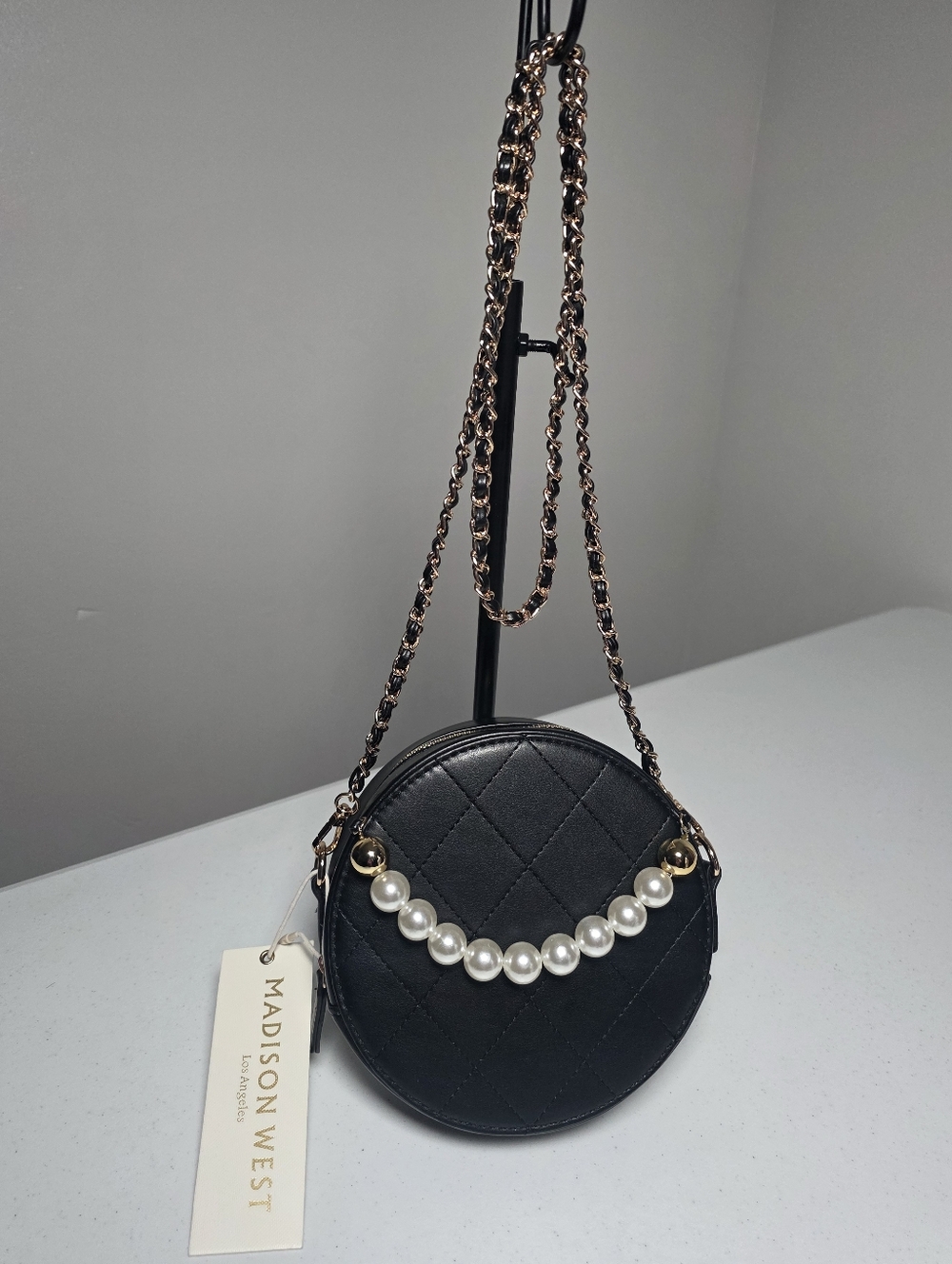 Madison West Black Quilted Round Crossbody with Pearl Detail and Gold Chain